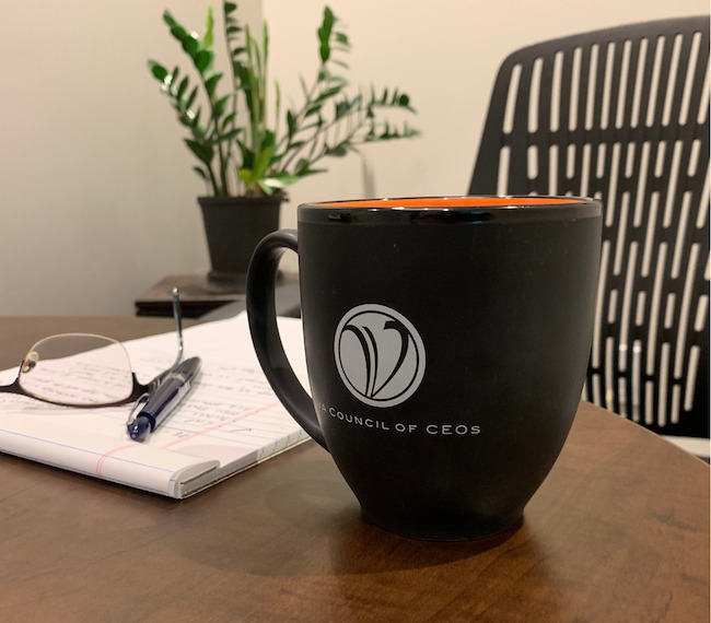 Coffee cup with VACEOs logo